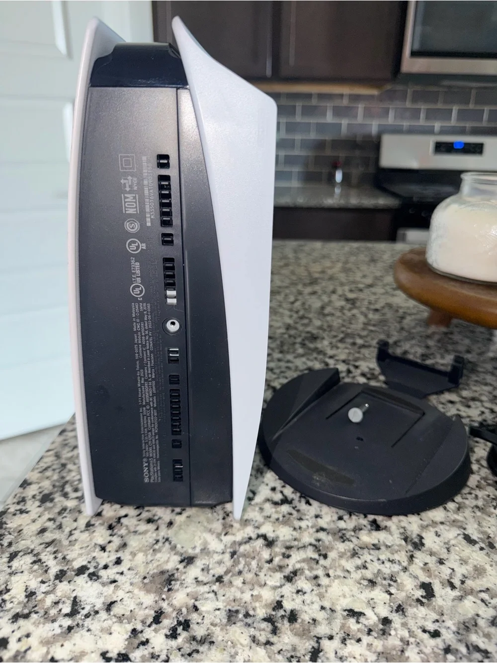 PS5 with HDMI/ power cords, controller, and stand.